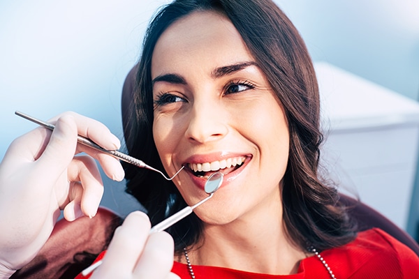 Boulder woman smiles at dentist showing off her permanent porcelain veneers 