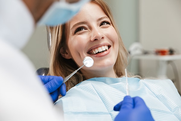 Boulder woman smiles up at dentist at Adler Advanced Dentistry