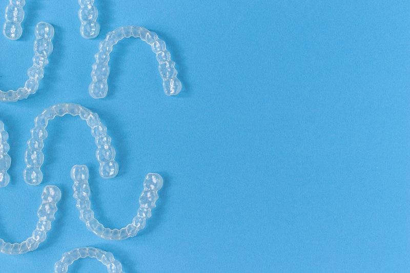 Invisalign braces on blue background