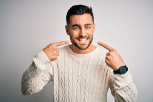Young,Handsome,Man,Wearing,Casual,Sweater,Standing,Over,Isolated,White