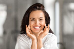 Woman with nice smile after dental implants to replace missing teeth in Boulder, CO