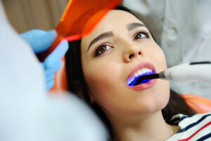 Woman getting white dental filling in Boulder, CO